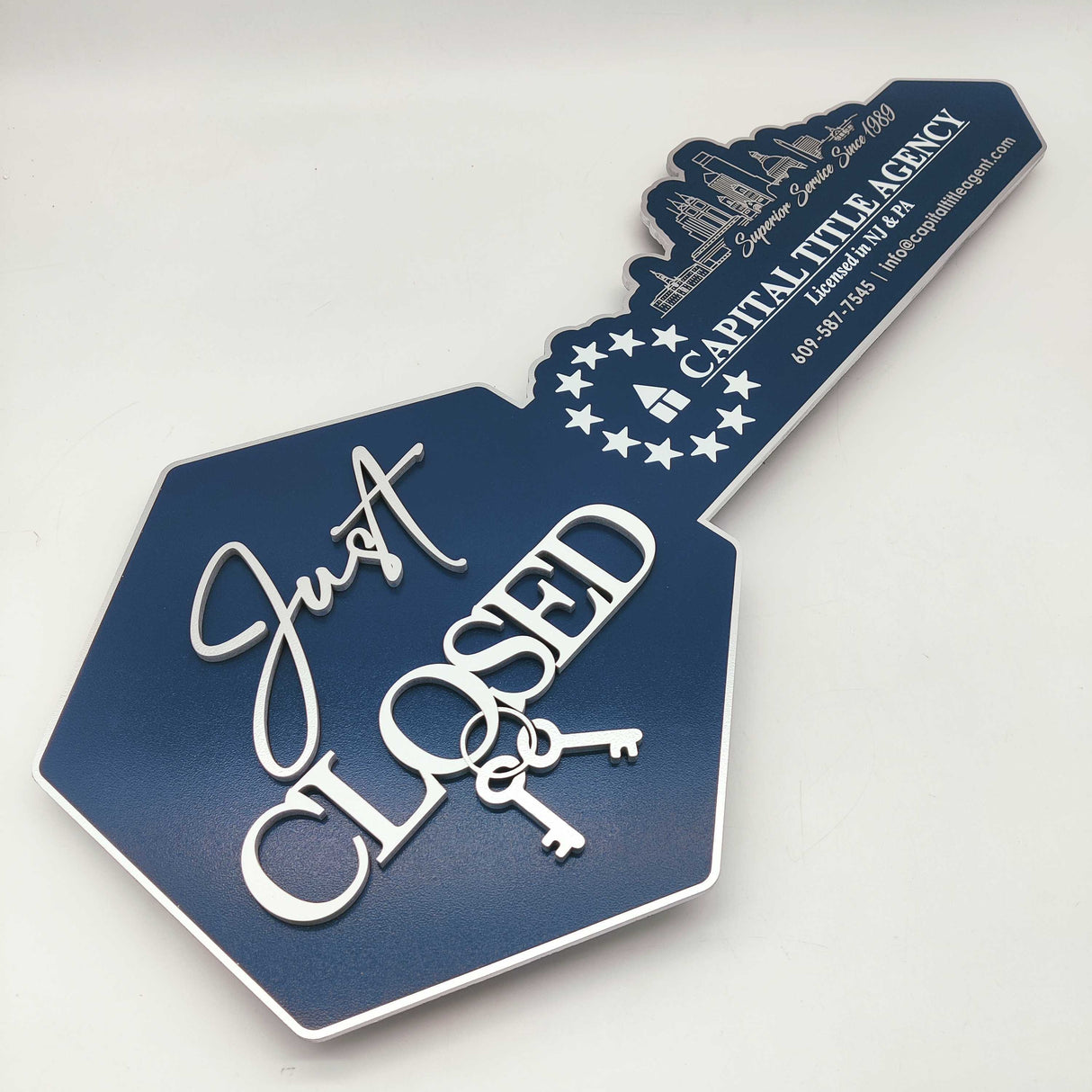 Just Closed Sign with a Cityscape