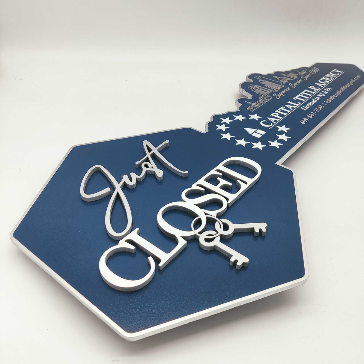 Just Closed Sign with a Cityscape