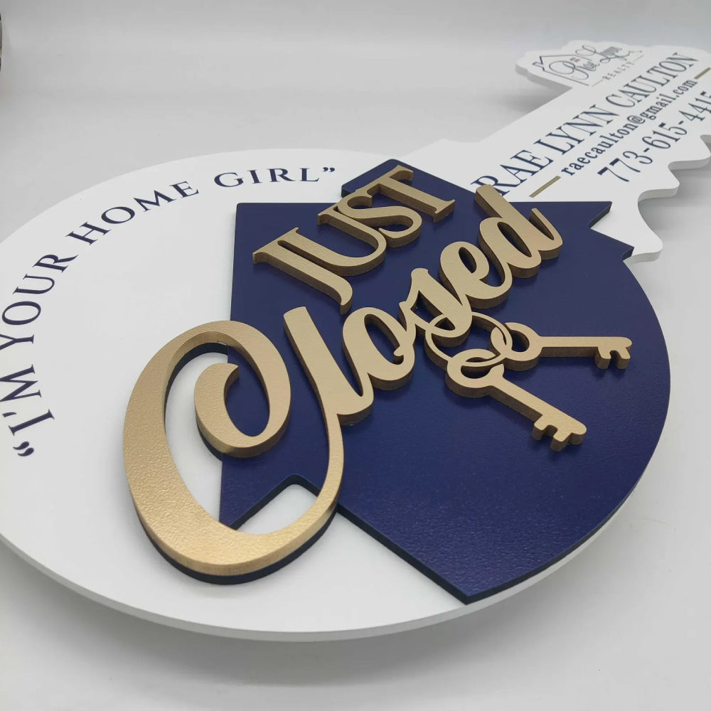 Sign with "Just Closed" gold and navy blue