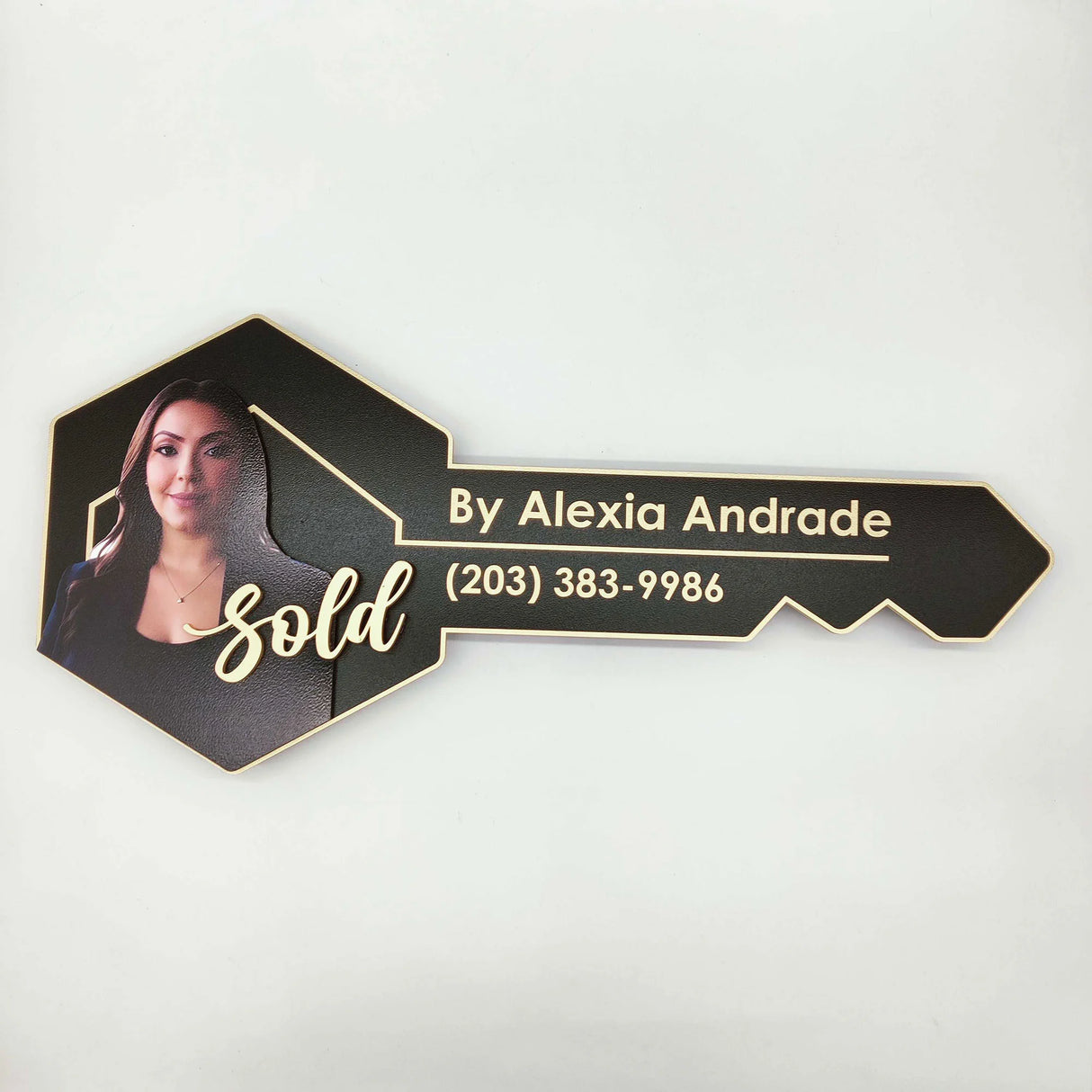 Black Key Shaped Sign with Gold Outline and 3D text "Sold"