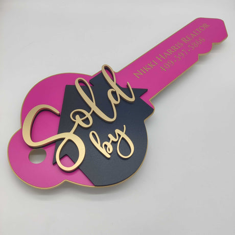 Key Shaped Pink Sold by Sign - Real Estate Store