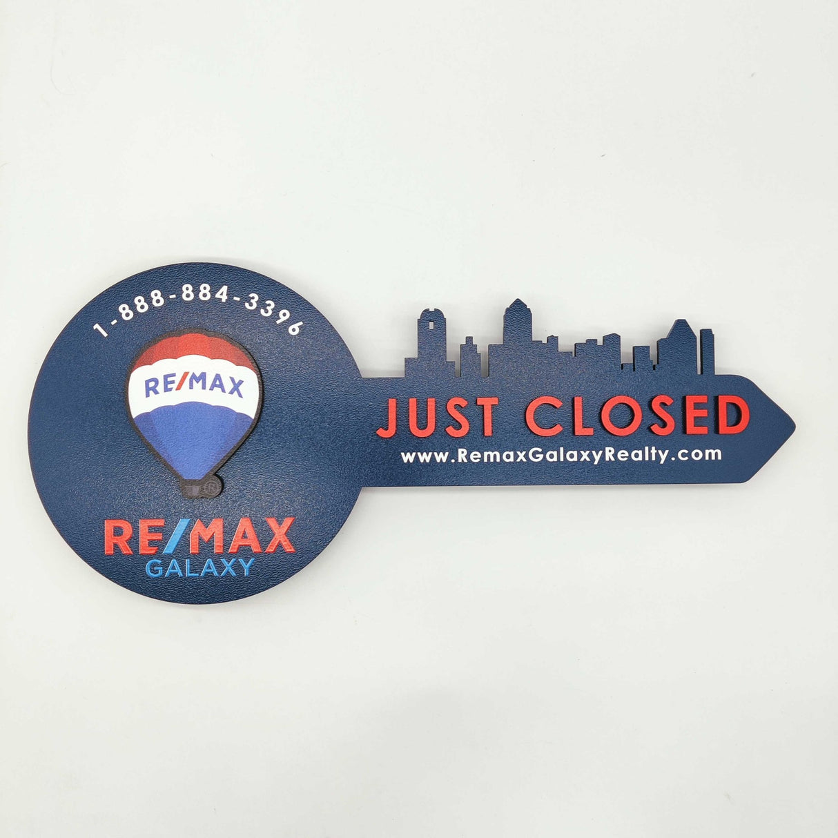 Navy Blue Round Shaped Key «Remax» - Real Estate Store
