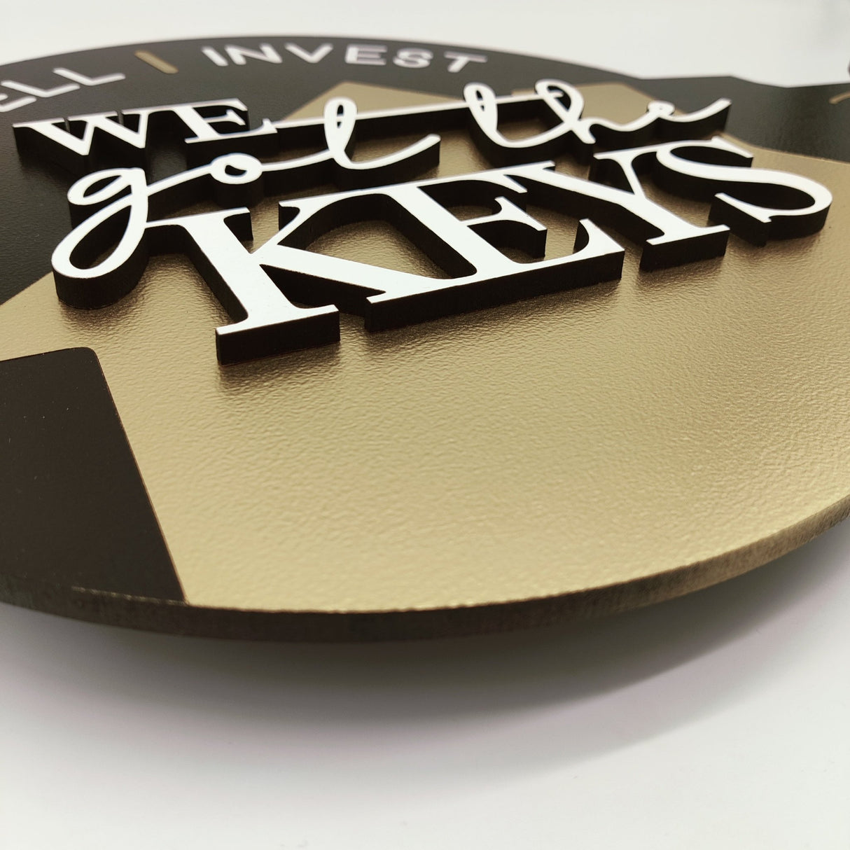 Round Shaped Key Sign «Buy, Sell, Invest» - Real Estate Store