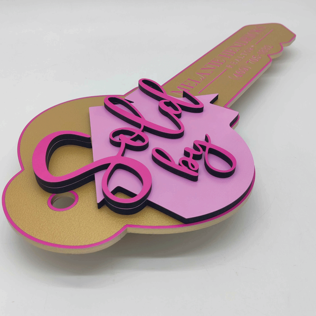Key Shaped Pink & Gold  Sold by Sign