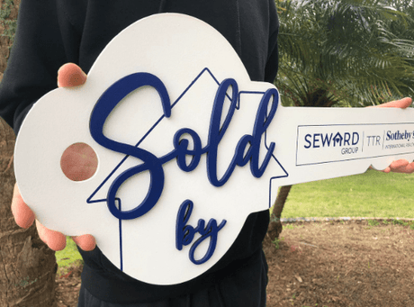 White Classic Key Shaped Prop «Sold By» with House Outline - Real Estate Store