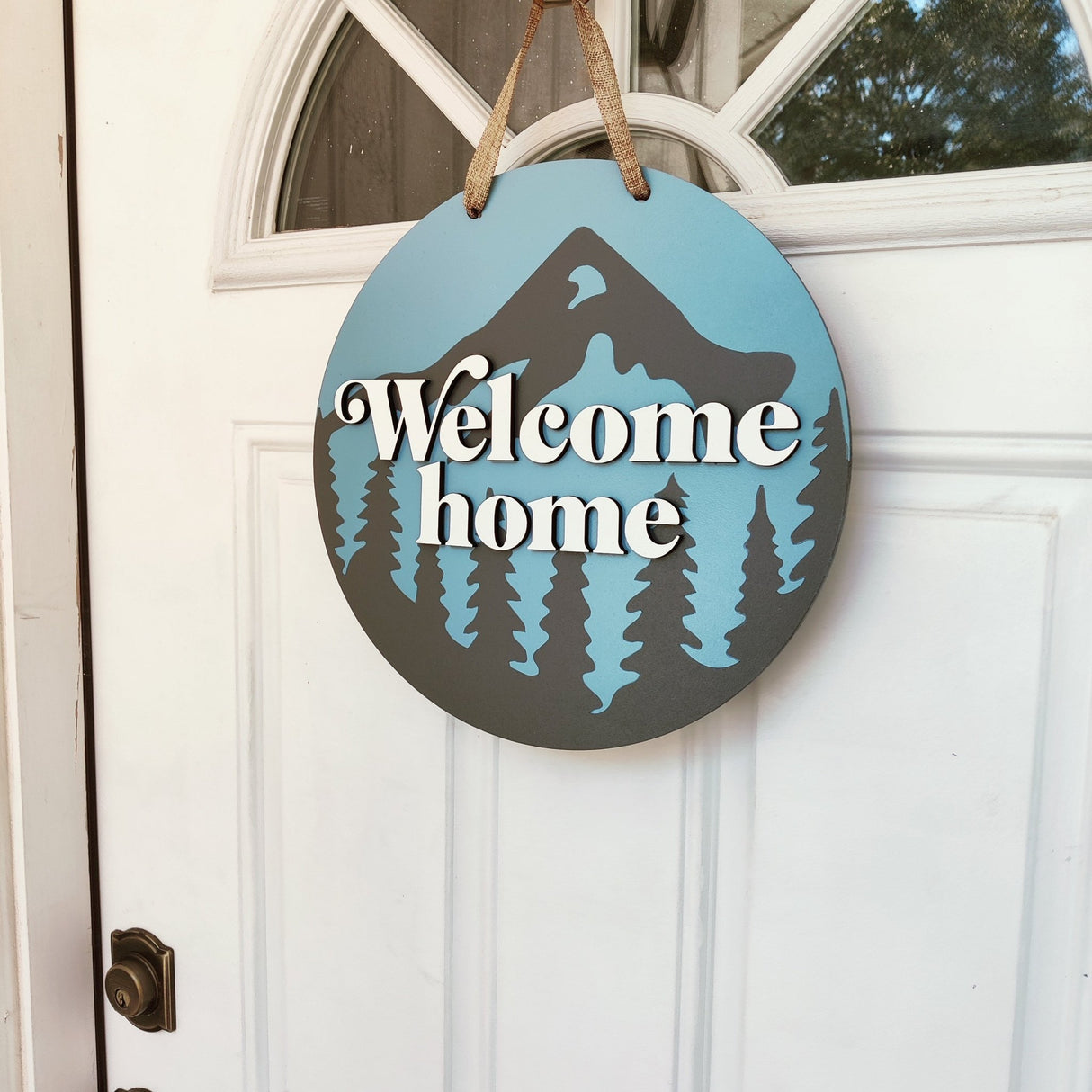 Wooden Front Door Hanger Sign «Welcome Home» with Mountains & Pines design - Real Estate Store
