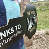 Black Key Shaped Sign White text "We Made Magic Happen"