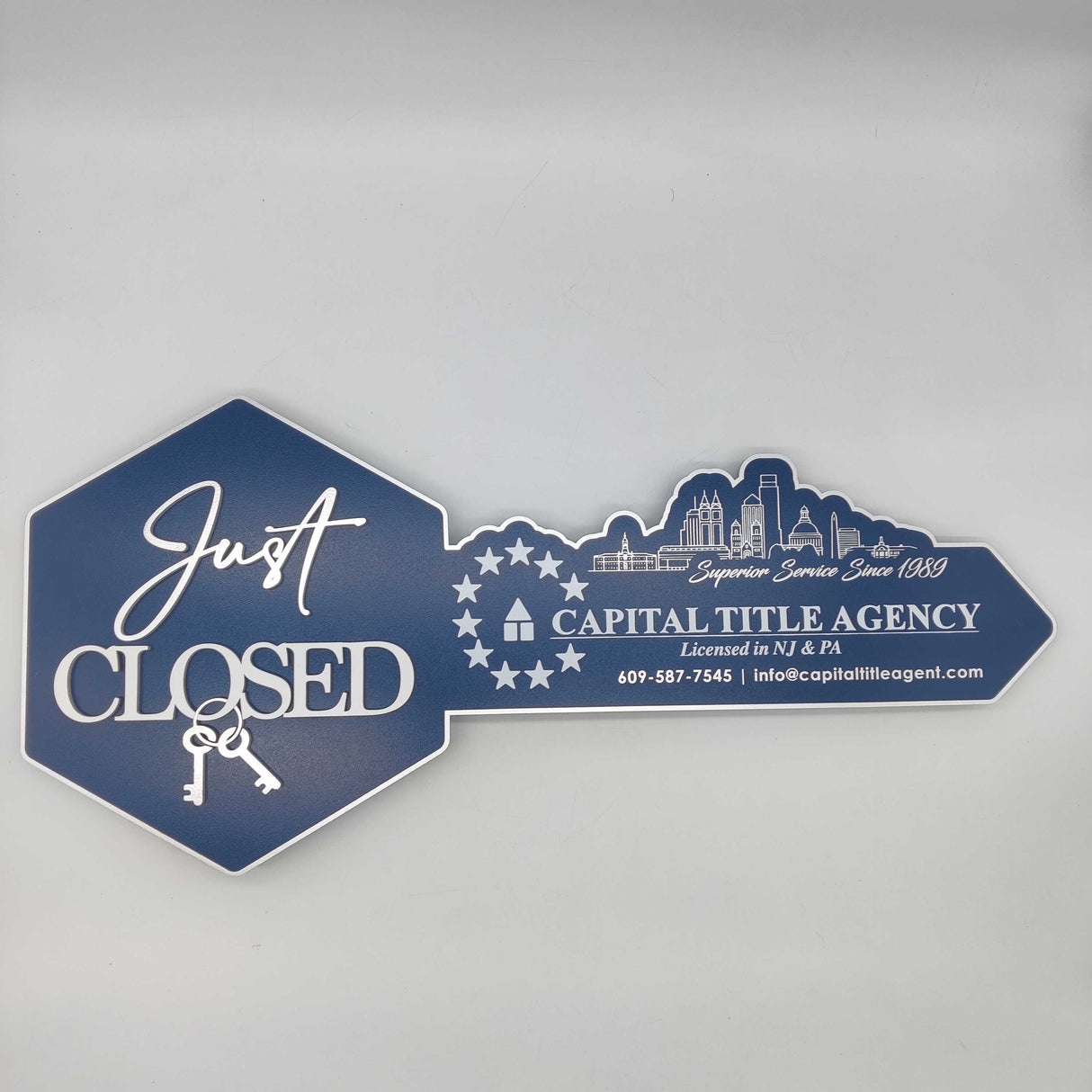 Just Closed Sign with a Cityscape