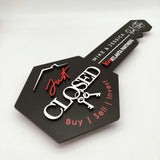 Black Key-Shaped Sign with "Just Closed " and hanging keys