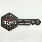 Black Key-Shaped Sign with "Just Closed " and hanging keys