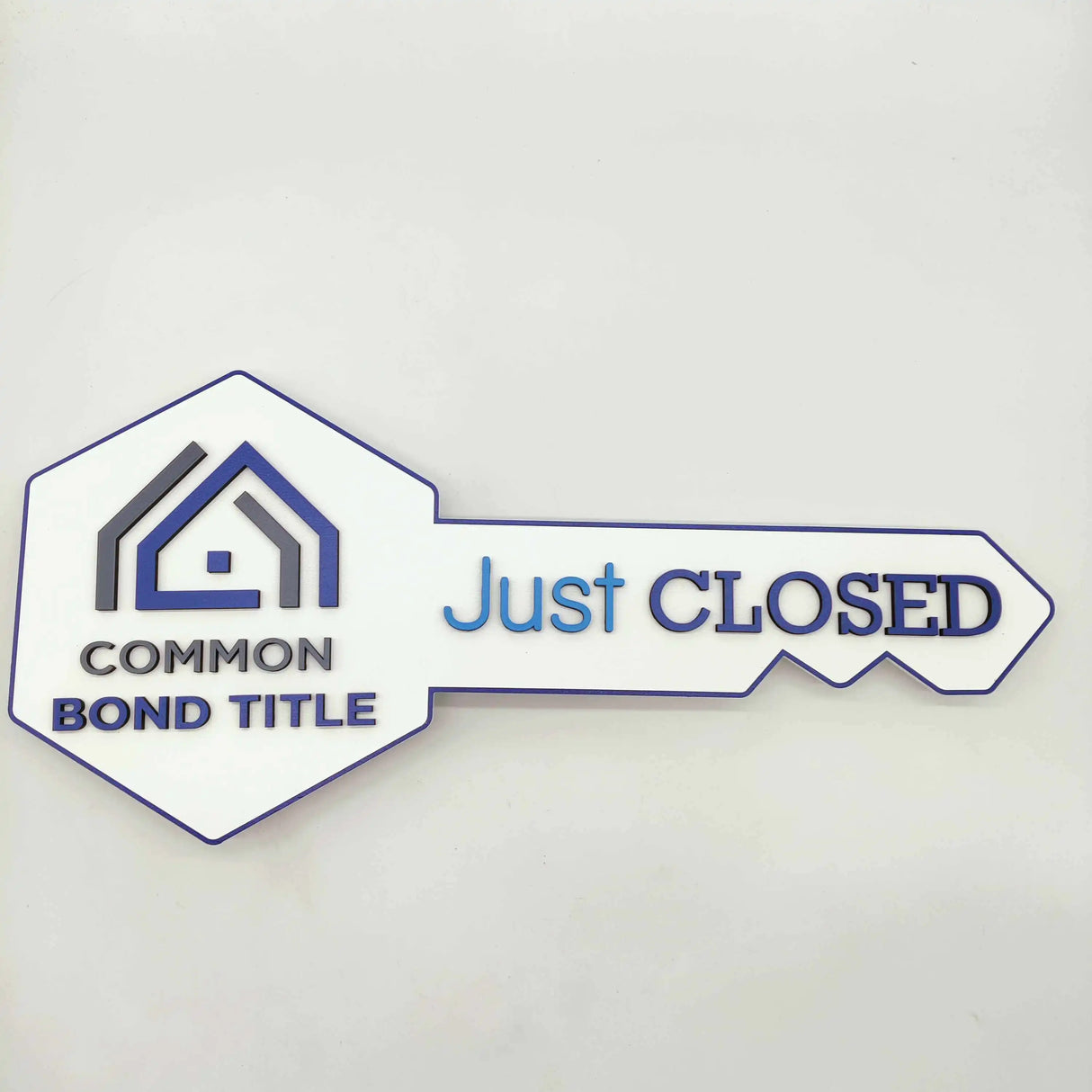 Key Shaped Sign White "Just Closed" with logo