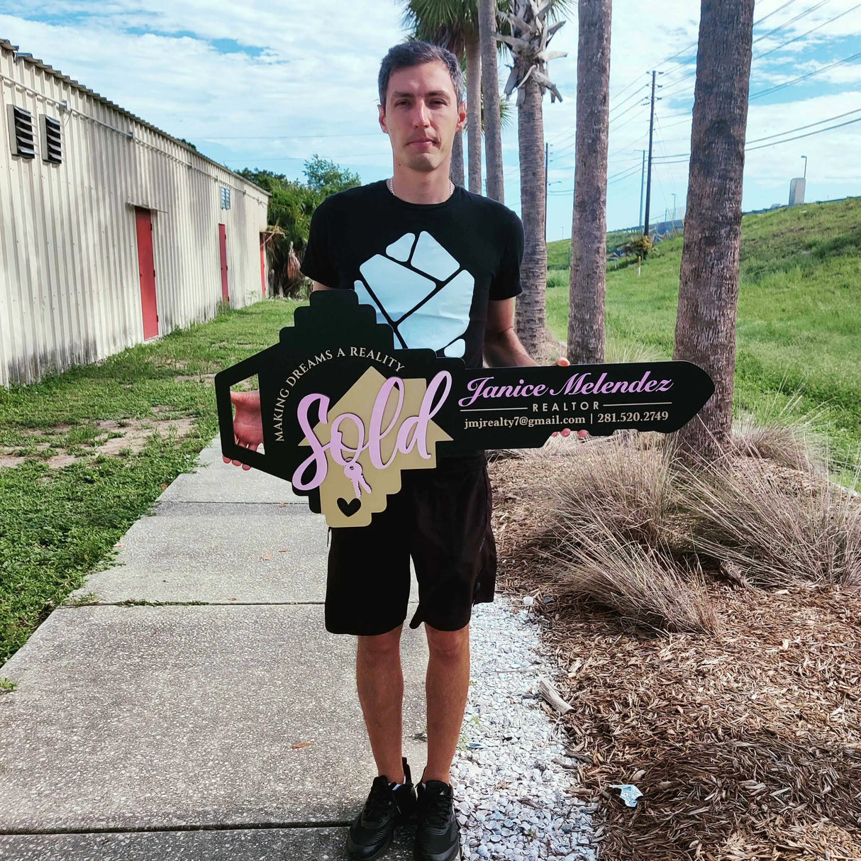 Black Key Shaped Sign Pink text "Sold"