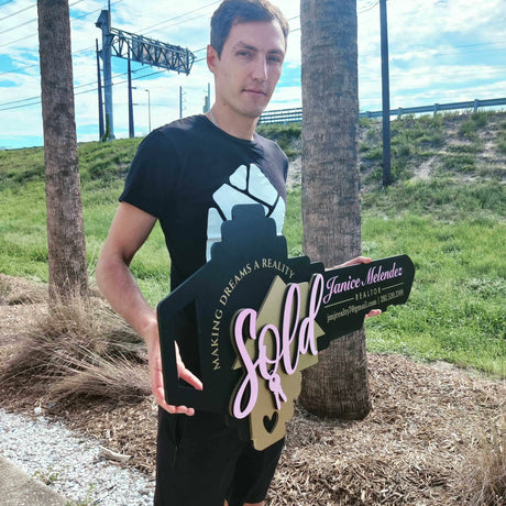 Black Key Shaped Sign Pink text "Sold"