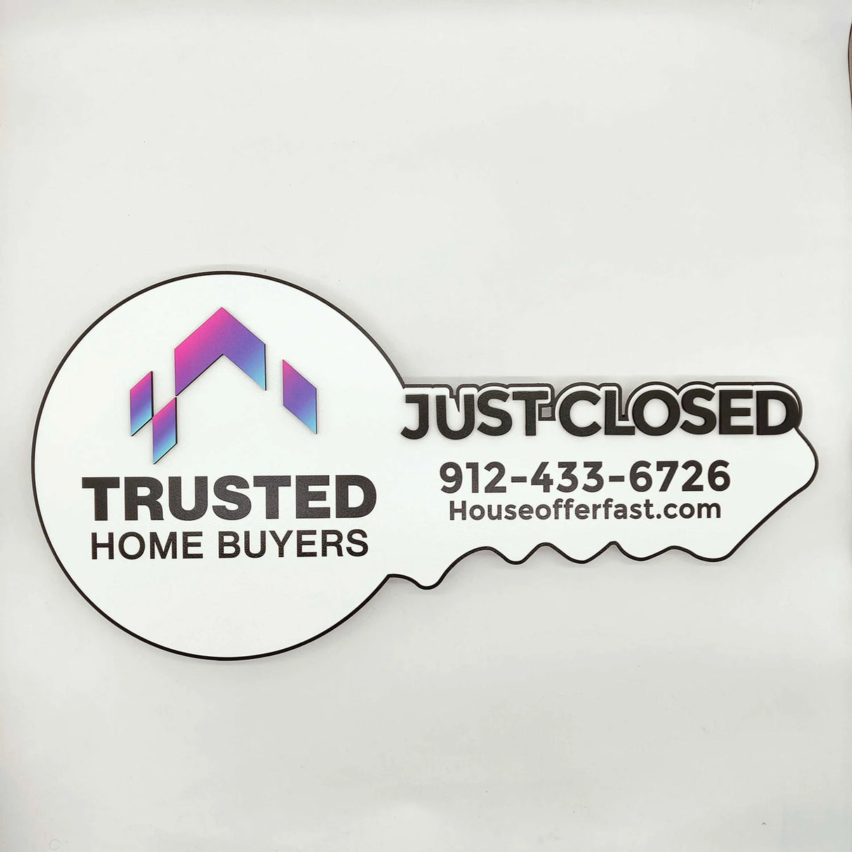 Key Shaped Sign With Logo Black text "Just Closed"