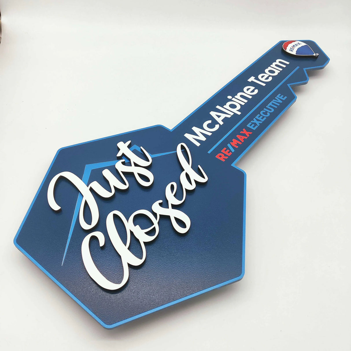 Key Shaped Sign Navy Blue and blue outline with 3D text "Just Closed"