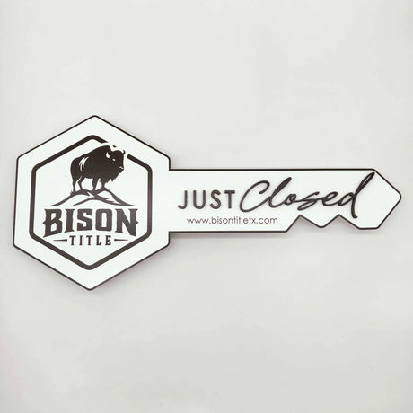 Key Shaped Sign White with Black text & outline "Just Closed"