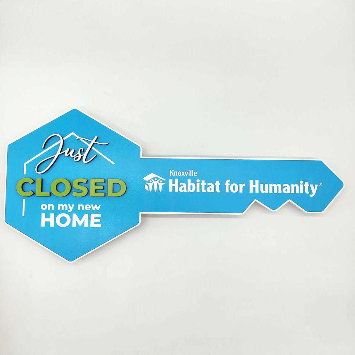 Key Shaped Sign Blue with With text & outline "Just Closed"