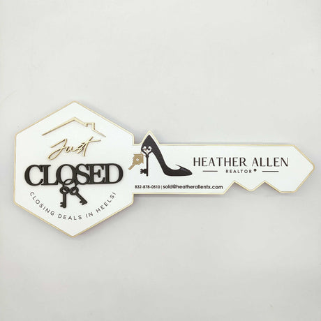 White Key-Shaped Sign "Closing deals in heels"