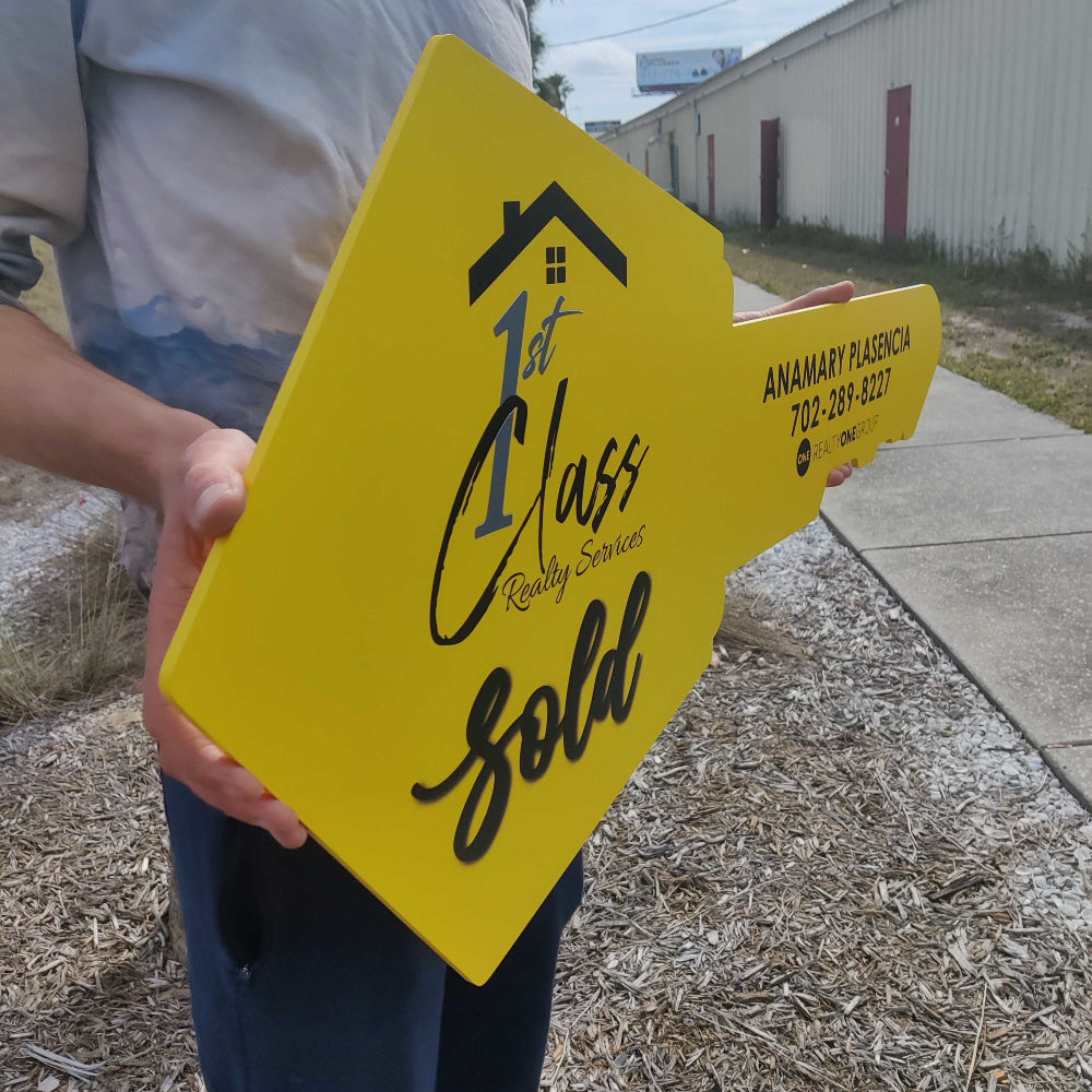 Yellow Sign For  1st Class Realty