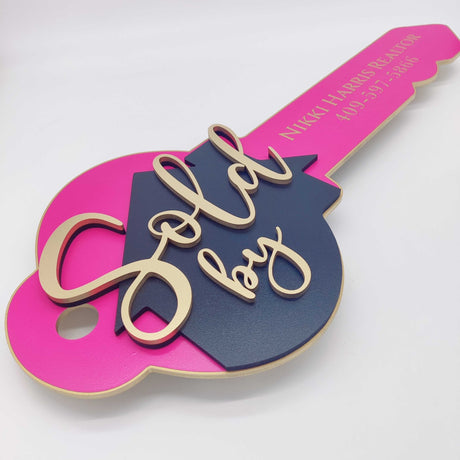 Key Shaped Pink Sold by Sign - Real Estate Store