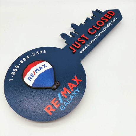 Navy Blue Round Shaped Key «Remax» - Real Estate Store