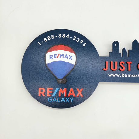 Navy Blue Round Shaped Key «Remax» - Real Estate Store