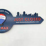 Navy Blue Round Shaped Key «Remax» - Real Estate Store