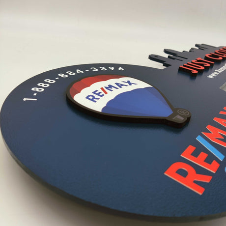 Navy Blue Round Shaped Key «Remax» - Real Estate Store
