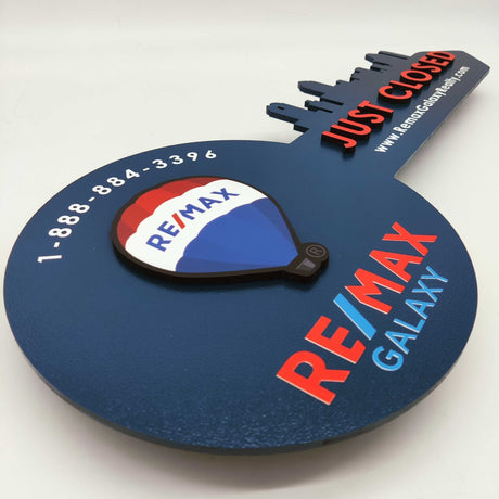 Navy Blue Round Shaped Key «Remax» - Real Estate Store