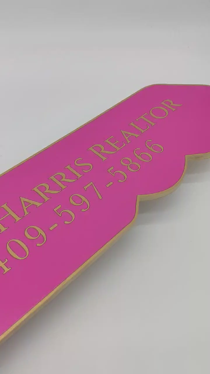 Key Shaped Pink Sold by Sign