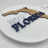 White Round Shaped Key Sign "Our Little Piece of Florida""