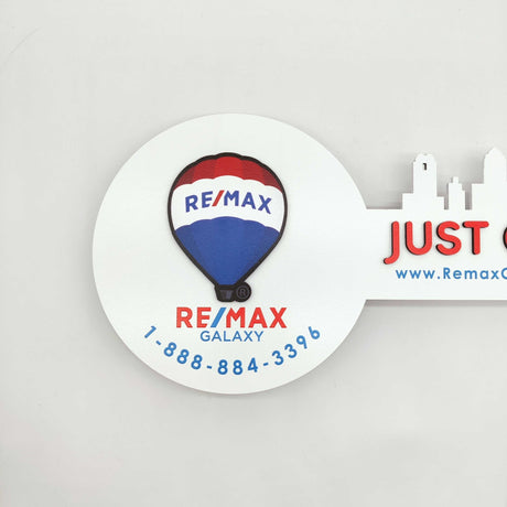 White Round Shaped Key «Remax» - Real Estate Store