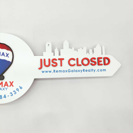 White Round Shaped Key «Remax» - Real Estate Store