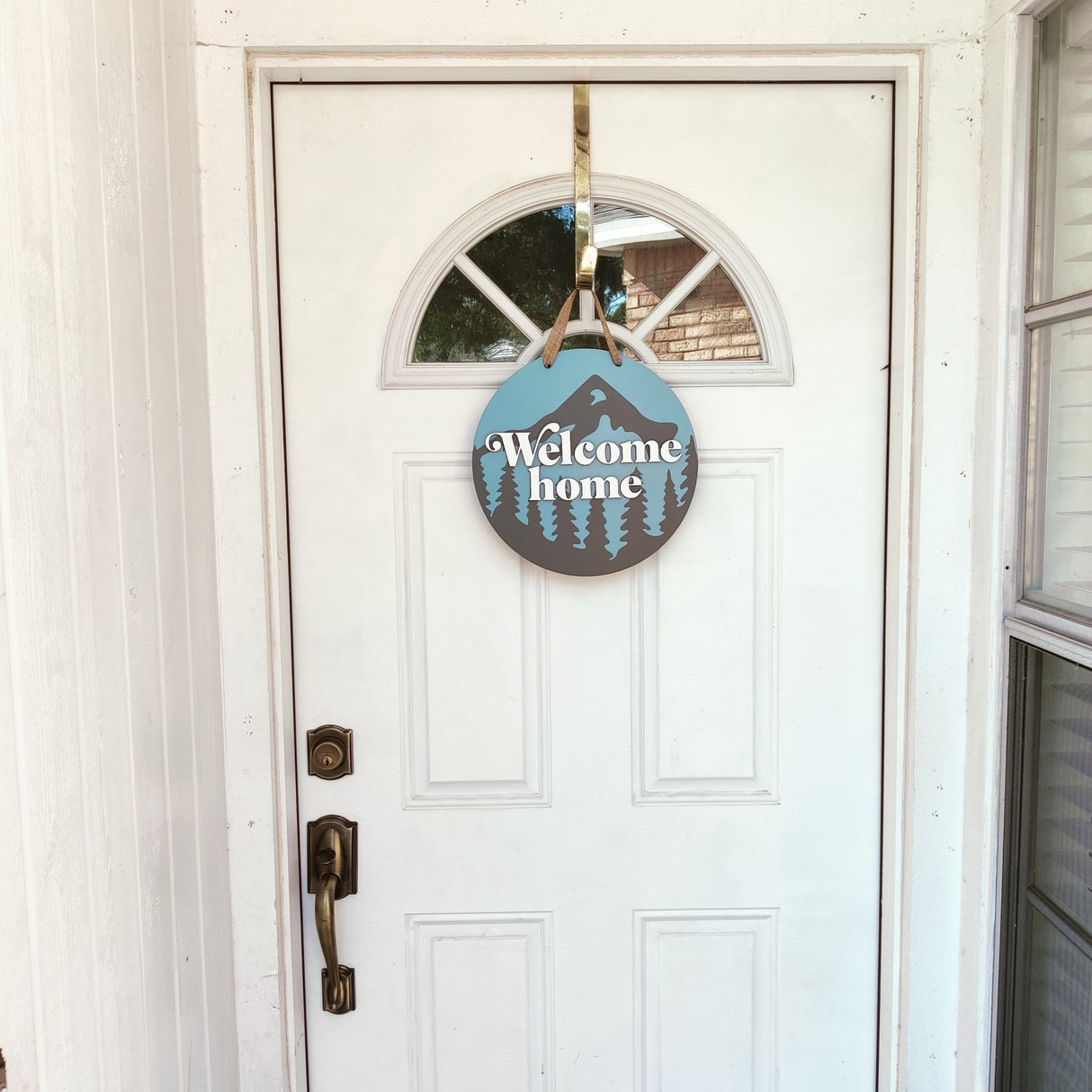 Wooden Front Door Hanger Sign «Welcome Home» with Mountains & Pines design - Real Estate Store